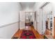 Hallway with hardwood floors and access to other rooms at 517 N East St, Raleigh, NC 27604