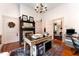 Bright home office features built-in shelving, a fireplace and hardwood floors at 517 N East St, Raleigh, NC 27604