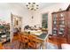 Spacious home office with hardwood floors, built-in bookcase and large windows at 517 N East St, Raleigh, NC 27604