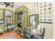 Country kitchen with green cabinets, chicken wallpaper and a farmhouse table at 517 N East St, Raleigh, NC 27604