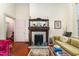 Living area with hardwood floors, a fireplace, and comfortable seating at 517 N East St, Raleigh, NC 27604