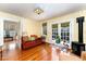 Relaxing sunroom with a wood burning stove and French doors at 517 N East St, Raleigh, NC 27604