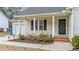 House entrance with a covered porch and landscaping at 608 Senter View Dr, Fuquay Varina, NC 27526