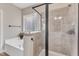 Spa-like bathroom with soaking tub and a walk-in shower at 6421 Grassy Knoll Ln, Raleigh, NC 27616