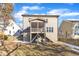 Tan house exterior with screened porch and stairs at 6421 Grassy Knoll Ln, Raleigh, NC 27616