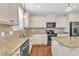 Modern kitchen with granite countertops and stainless steel appliances at 6421 Grassy Knoll Ln, Raleigh, NC 27616