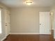 Simple bedroom with hardwood floors and neutral walls at 6793 Stricklands Crossroads Rd, Four Oaks, NC 27524