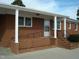 Brick ranch home with covered porch and accessible ramp at 6793 Stricklands Crossroads Rd, Four Oaks, NC 27524