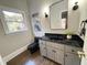 Elegant bathroom with black fixtures and a soaking tub at 704 Misty Isle Pl, Raleigh, NC 27615