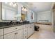 Elegant bathroom with double sinks, soaking tub, and shower at 704 Misty Isle Pl, Raleigh, NC 27615