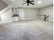 Bonus room with wet bar, carpet, and access to upper level at 704 Misty Isle Pl, Raleigh, NC 27615