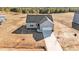 Aerial view showcasing the home's front entrance, driveway, and landscaping at 75 Brookhaven Dr, Spring Hope, NC 27882