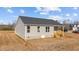 Rear view of a gray sided home featuring a small wooden deck at 75 Brookhaven Dr, Spring Hope, NC 27882