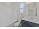 A well-lit bathroom with a tub-shower, modern vanity, and stylish fixtures at 75 Brookhaven Dr, Spring Hope, NC 27882