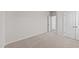 A bedroom featuring neutral walls, plush carpeting and doors leading to other rooms at 75 Brookhaven Dr, Spring Hope, NC 27882