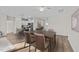 Open-concept dining area and kitchen with modern finishes and stylish furnishings at 75 Brookhaven Dr, Spring Hope, NC 27882