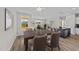 Bright dining area features a table and chairs, with views of the living room and outdoors at 75 Brookhaven Dr, Spring Hope, NC 27882