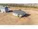 Aerial view of a new home with a small deck, on a spacious lot with few trees at 75 Brookhaven Dr, Spring Hope, NC 27882