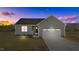 Gray siding house with a 2-car garage and landscaped yard at 75 Brookhaven Dr, Spring Hope, NC 27882