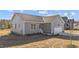 View of the gray home featuring an attached garage and landscaped yard at 75 Brookhaven Dr, Spring Hope, NC 27882