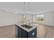 Modern kitchen with island and stainless steel appliances at 75 Brookhaven Dr, Spring Hope, NC 27882