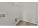 A practical laundry room with a wire shelf, washer hookups, and vinyl flooring at 75 Brookhaven Dr, Spring Hope, NC 27882