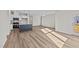 Spacious living room with vinyl plank flooring and large windows at 75 Brookhaven Dr, Spring Hope, NC 27882