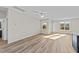 Bright living room with vinyl plank flooring and access to deck at 75 Brookhaven Dr, Spring Hope, NC 27882