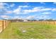 This expansive fenced backyard provides lots of room for outdoor activities at 8 Looping Horse Cir, Angier, NC 27501