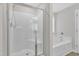 Bright bathroom featuring a sleek glass-door shower and a separate soaking tub at 8 Looping Horse Cir, Angier, NC 27501