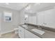 Bathroom featuring double sink vanity, ample mirror space, and tile flooring at 8 Looping Horse Cir, Angier, NC 27501
