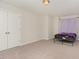 Well-lit bedroom with double doors and neutral decor at 8 Looping Horse Cir, Angier, NC 27501