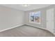 This bedroom features soft carpet, a window with natural light, and neutral walls at 8 Looping Horse Cir, Angier, NC 27501