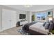 Cozy bedroom featuring a comfortable bed, a TV, and a window with a view of the outside at 8 Looping Horse Cir, Angier, NC 27501