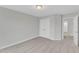 A spacious bedroom features neutral carpet, double doors, and a transom window view at 8 Looping Horse Cir, Angier, NC 27501