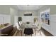 A spacious dining room featuring a large table, modern decor, and ample natural light creates an inviting atmosphere at 8 Looping Horse Cir, Angier, NC 27501