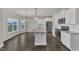 Spacious kitchen features stainless steel appliances, granite countertops, and white cabinetry at 8 Looping Horse Cir, Angier, NC 27501
