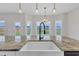 Bright kitchen features a farmhouse sink, granite countertops, and modern lighting at 8 Looping Horse Cir, Angier, NC 27501