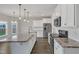 Modern kitchen boasts an island, stainless appliances, granite counters, and white cabinets at 8 Looping Horse Cir, Angier, NC 27501