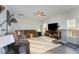 Spacious living room with brown sectional sofa and hardwood floors at 8 Looping Horse Cir, Angier, NC 27501