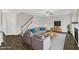 Inviting living room with a comfortable gray sofa, modern decor, and hardwood floors creates a warm atmosphere at 8 Looping Horse Cir, Angier, NC 27501