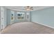 Large bedroom with carpet, ceiling fan and many windows providing lots of natural light at 8 Looping Horse Cir, Angier, NC 27501