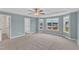 Spacious bedroom with carpet, ceiling fan and many windows providing lots of natural light at 8 Looping Horse Cir, Angier, NC 27501