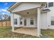 The covered patio provides a perfect space for relaxing, shielded from the elements at 8 Looping Horse Cir, Angier, NC 27501