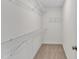 Walk-in closet with multiple levels of white wire shelving at 8 Looping Horse Cir, Angier, NC 27501