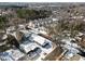 Overhead view showcases neighborhood homes and townhouses blanketed in winter snow at 819 Cumberland St, Raleigh, NC 27610