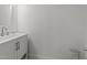 Modern bathroom with light fixture, sink, and storage space underneath at 819 Cumberland St, Raleigh, NC 27610