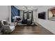 This bedroom features a decorative accent wall, modern furnishings, and great natural light at 819 Cumberland St, Raleigh, NC 27610