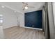 This spacious bedroom features a decorative accent wall, hardwood floors, and plenty of natural light at 819 Cumberland St, Raleigh, NC 27610