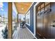 Bright and airy front porch with rocking chair and wooden flooring at 819 Cumberland St, Raleigh, NC 27610